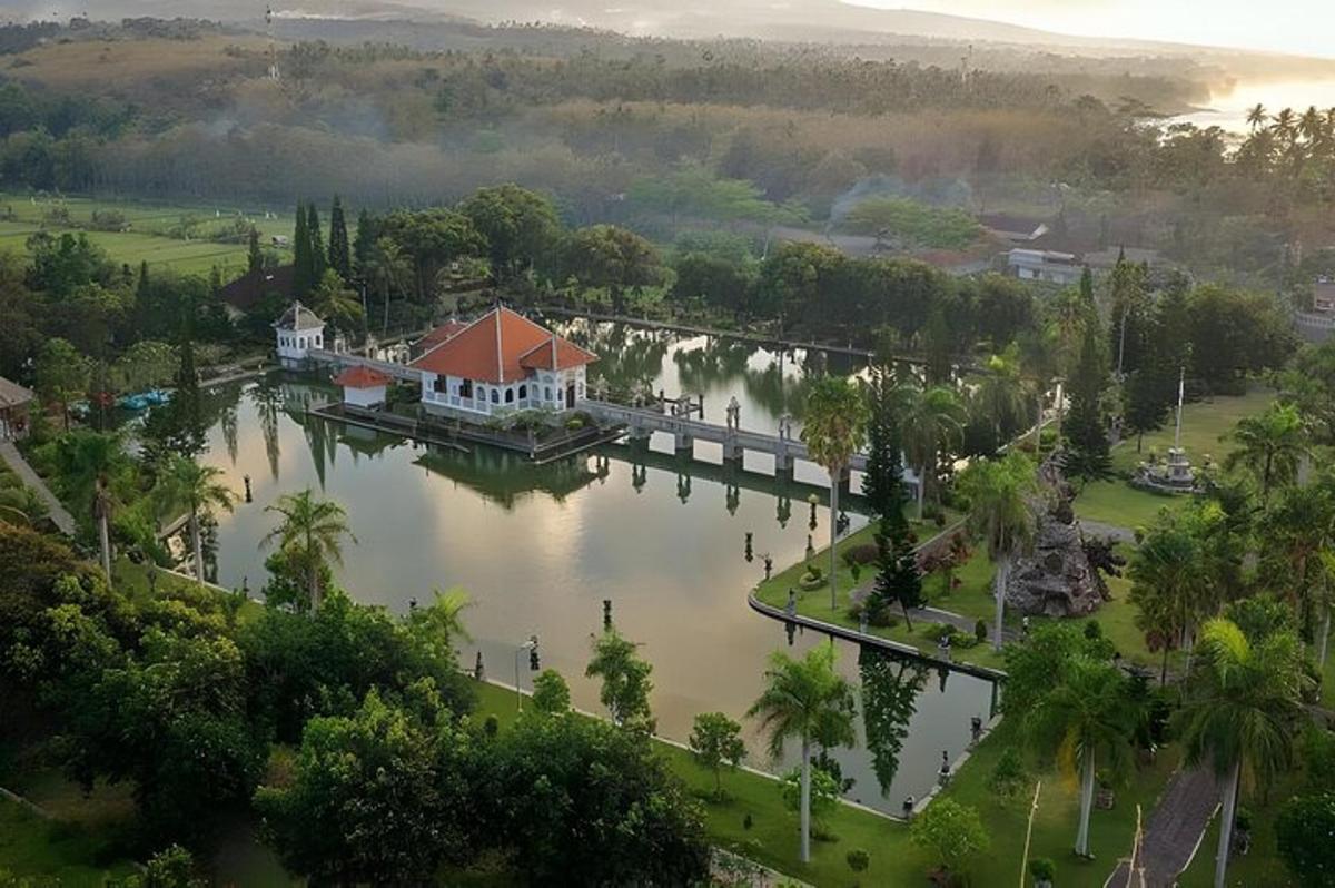 an aerial view of a house on a dock on a lake