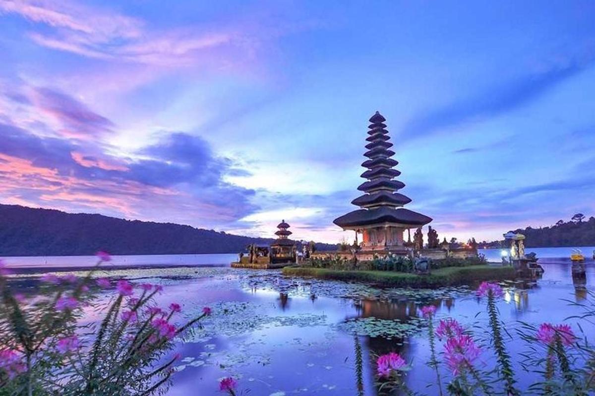 a island with a pagoda in the middle of a lake