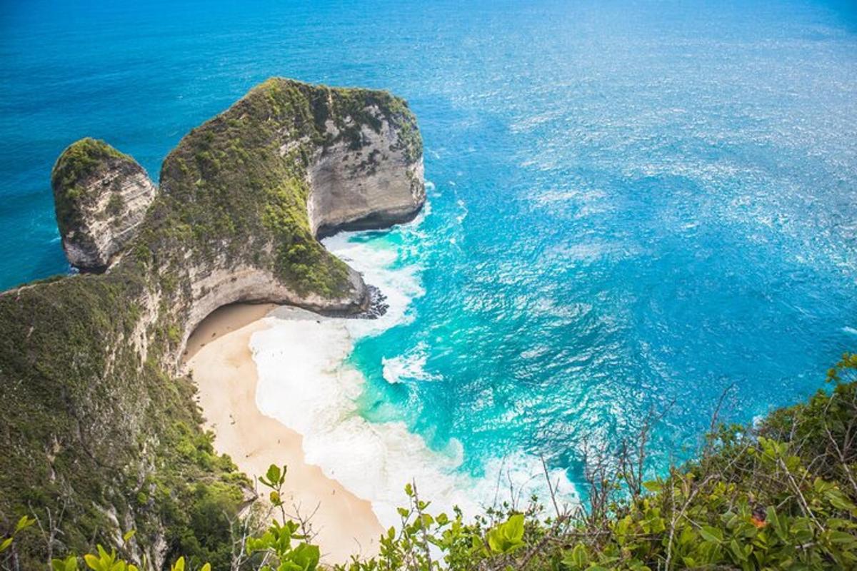 an aerial view of a beach next to the ocean