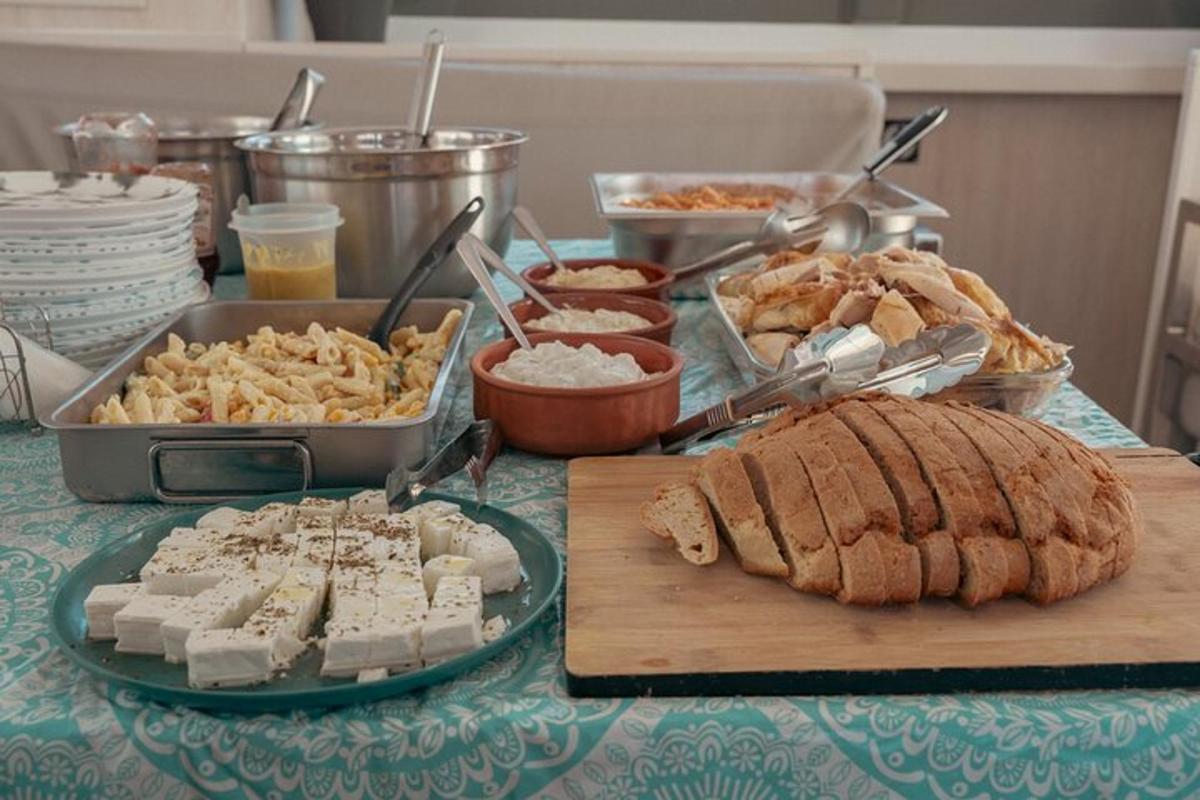 a table with a buffet of food and meats and cheese