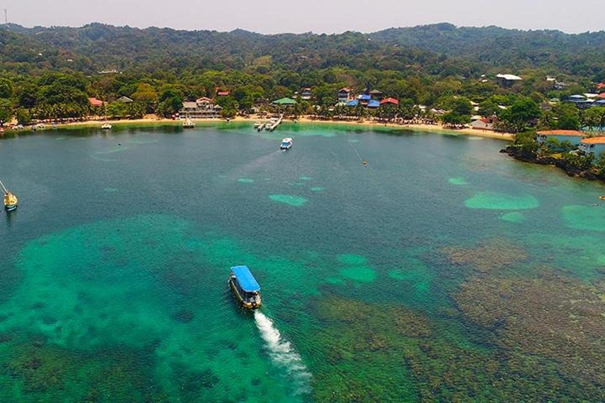 an island with a boat in a body of water