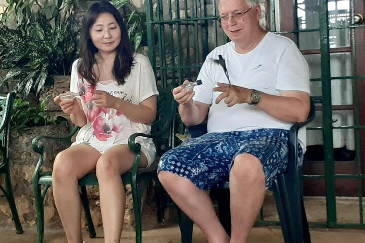 a man and a woman sitting on a bench