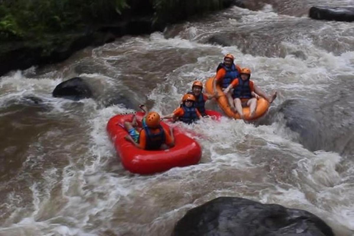 a group of people in a raft in a river