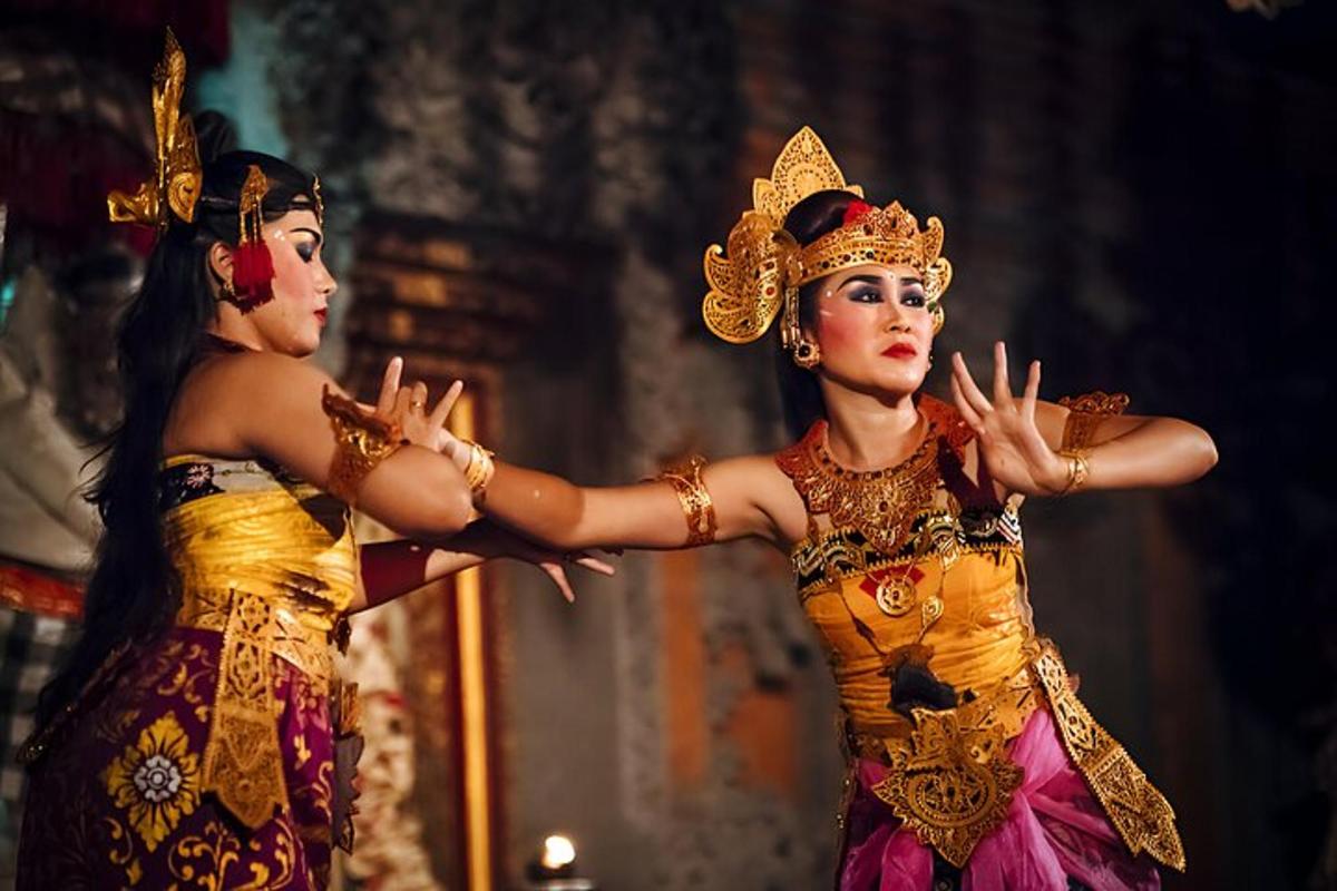 two women in costumes on stage in a performance