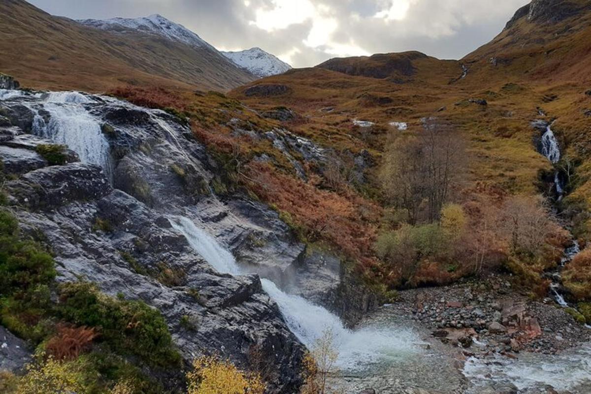 a waterfall on the side of a mountain