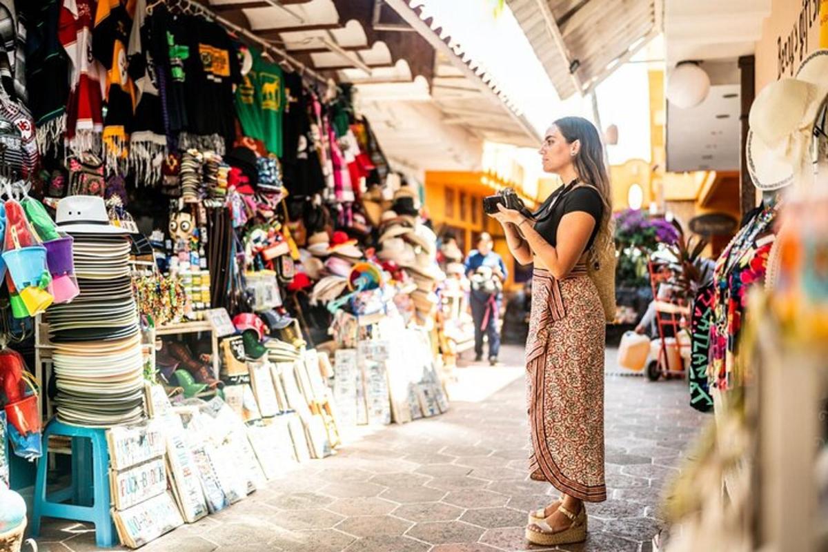 a woman standing in a market looking at her cell phone