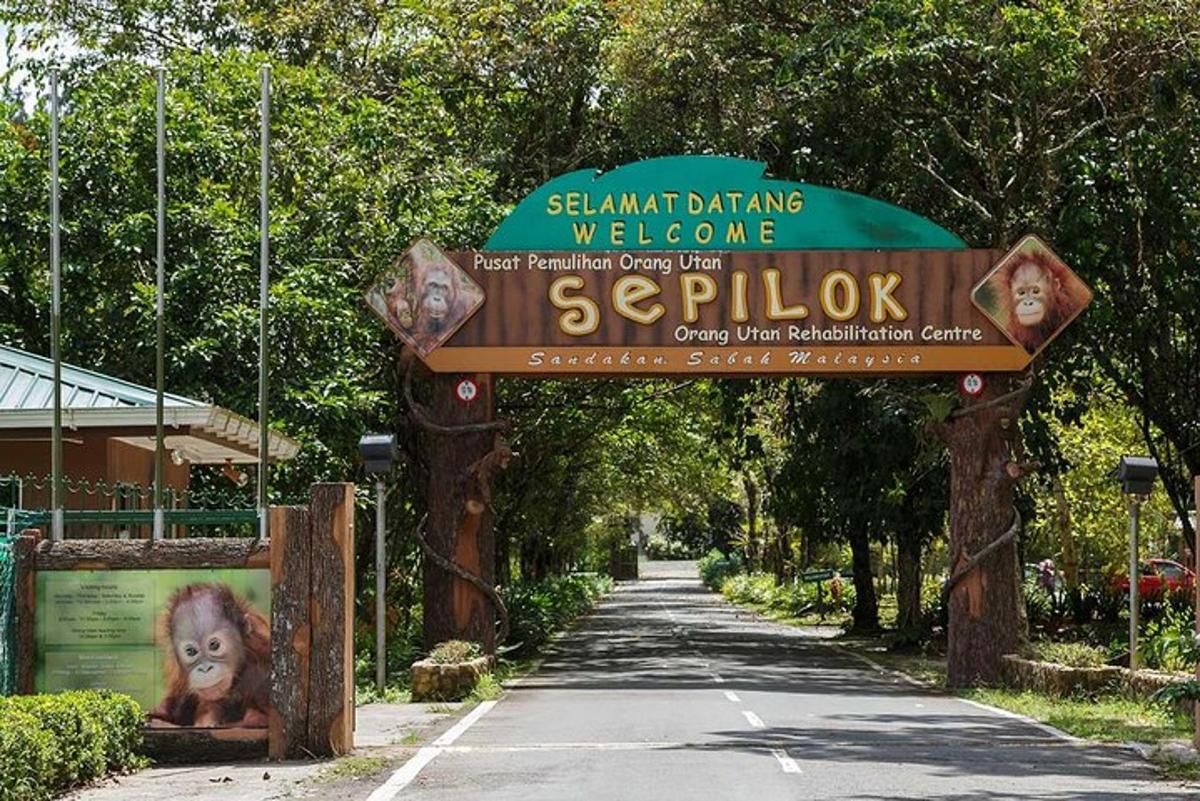 a sign for a zoo with a monkey on it