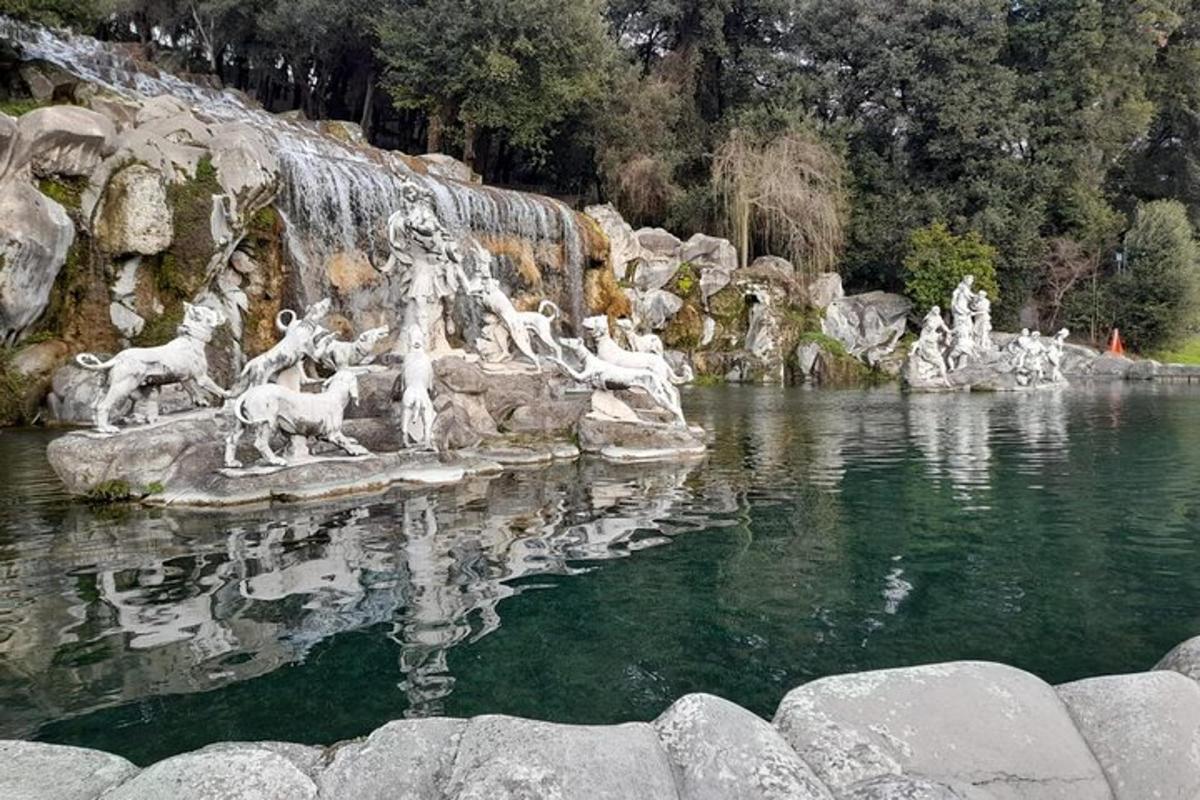 a statue of animals in a body of water