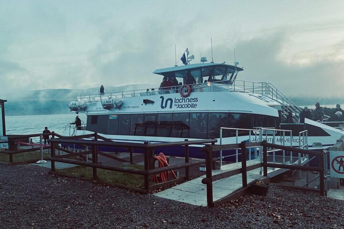 a large boat is docked at a dock