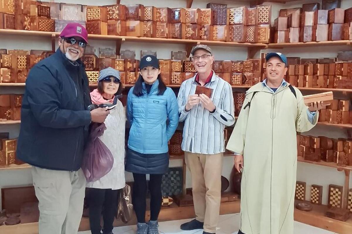 a group of people standing in front of a shelf
