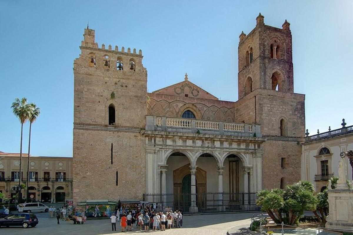 a group of people standing outside of a large building