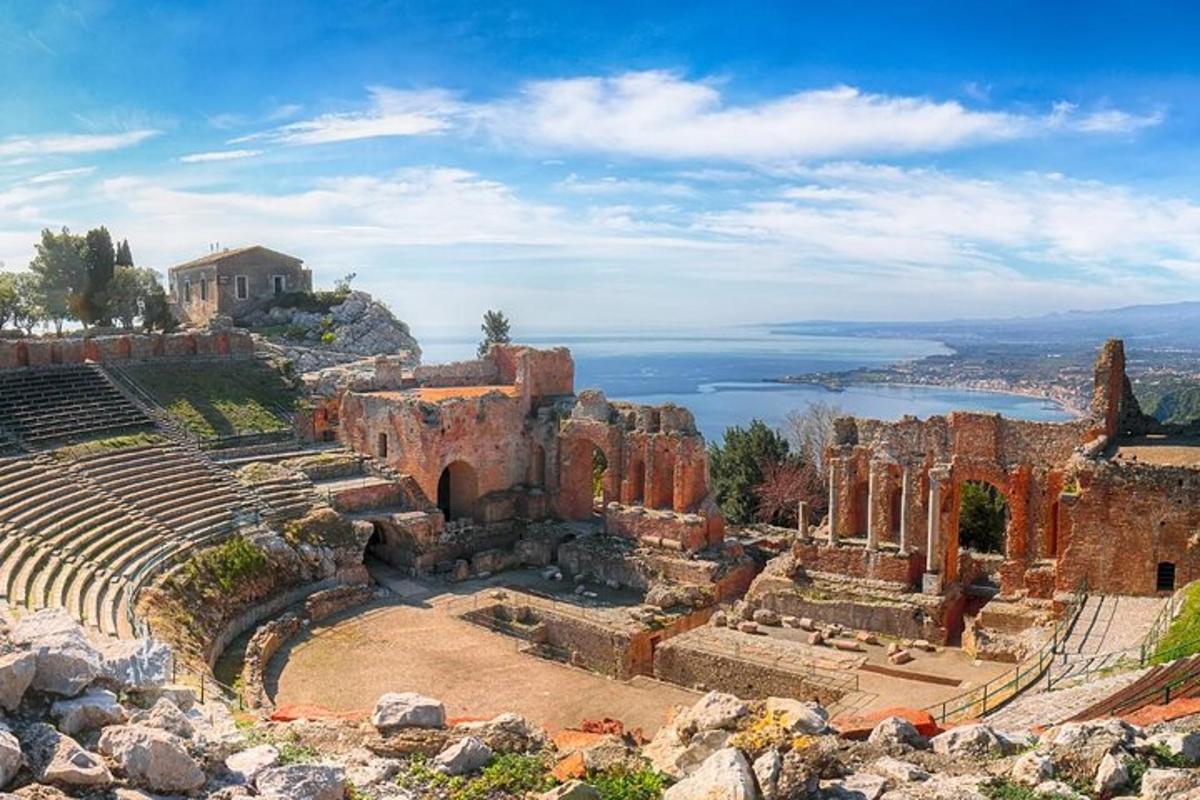 an amphitheater with a view of a body of water