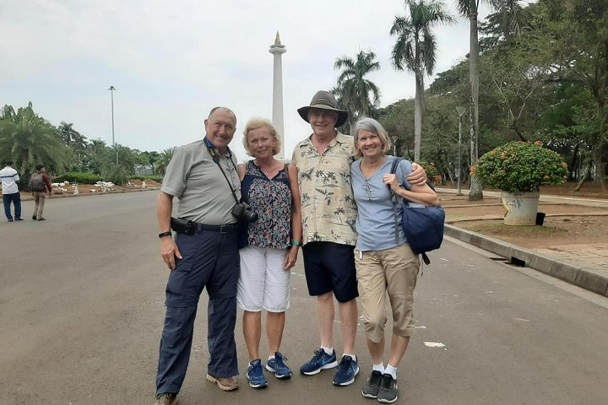 a group of people posing for a picture on the street