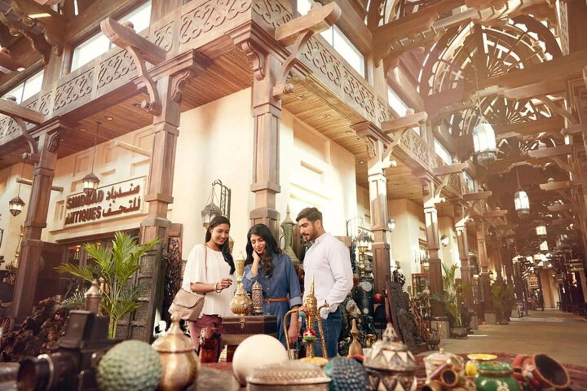a group of three people standing in a large building
