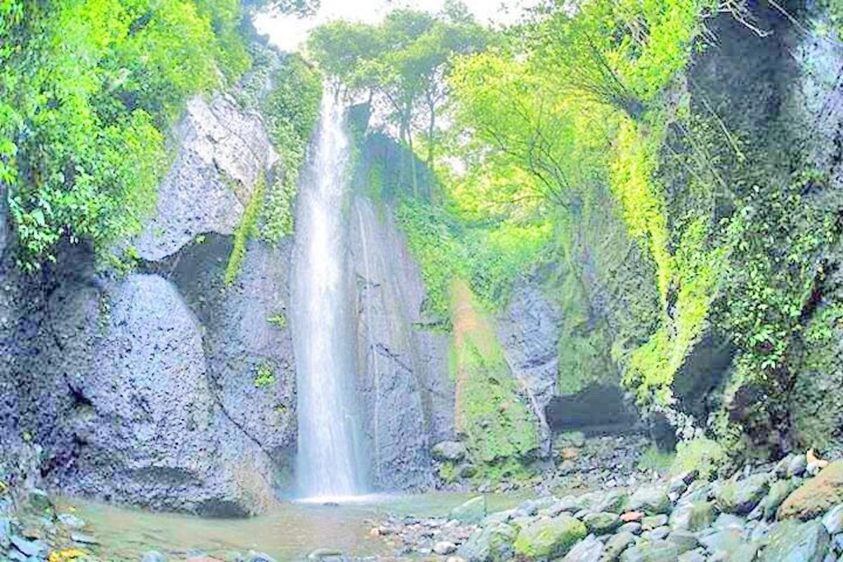 a painting of a waterfall on the side of a mountain