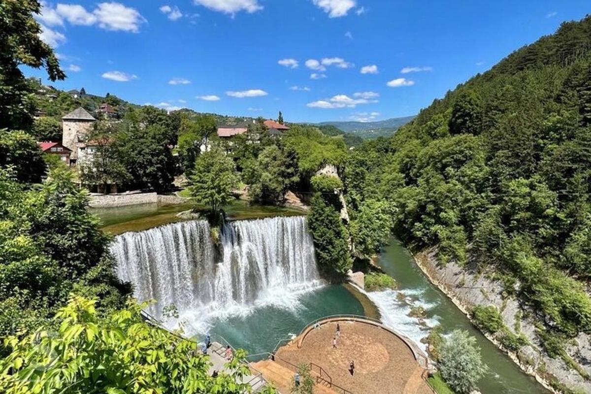 a waterfall in the middle of a river