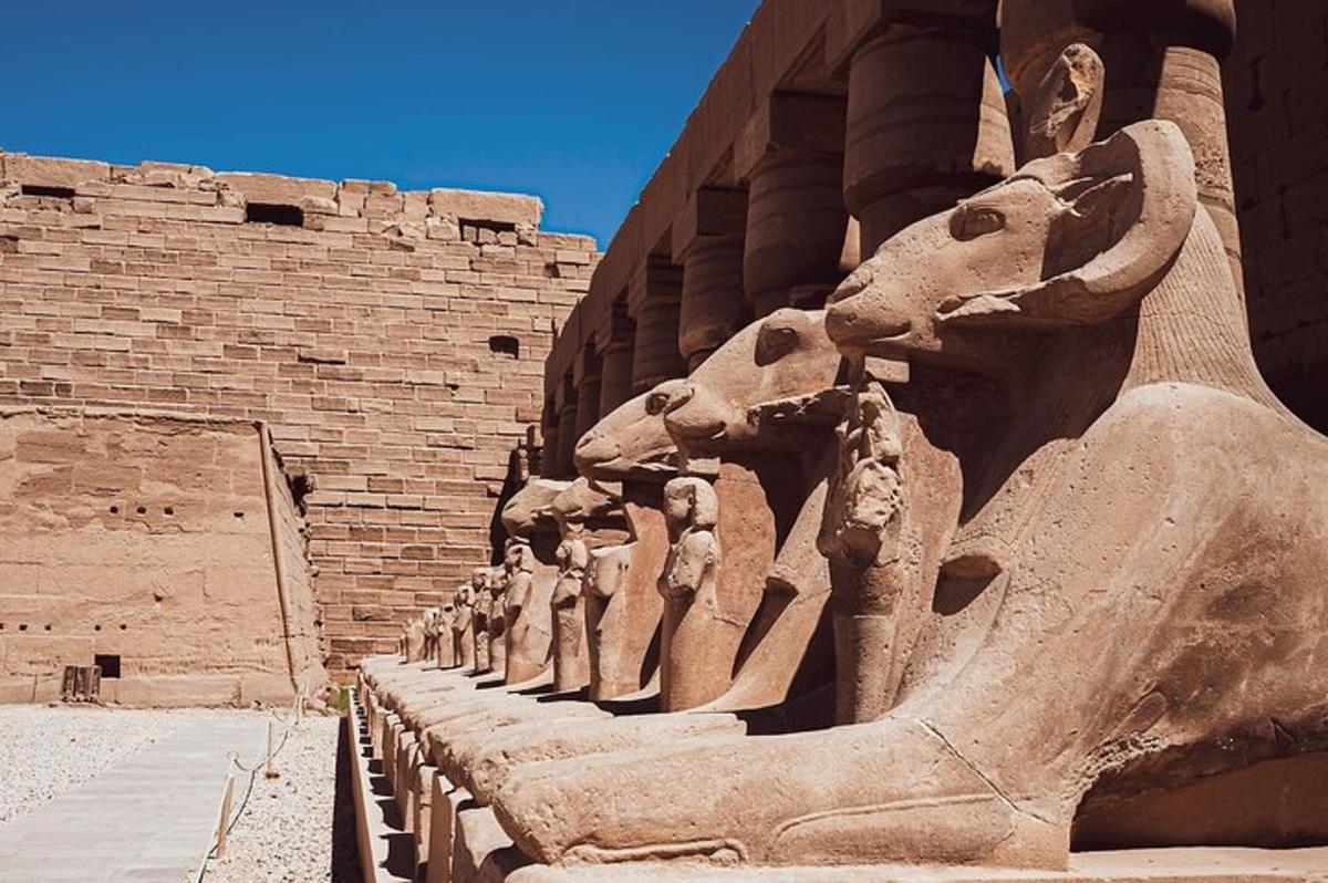 a group of statues standing next to a building