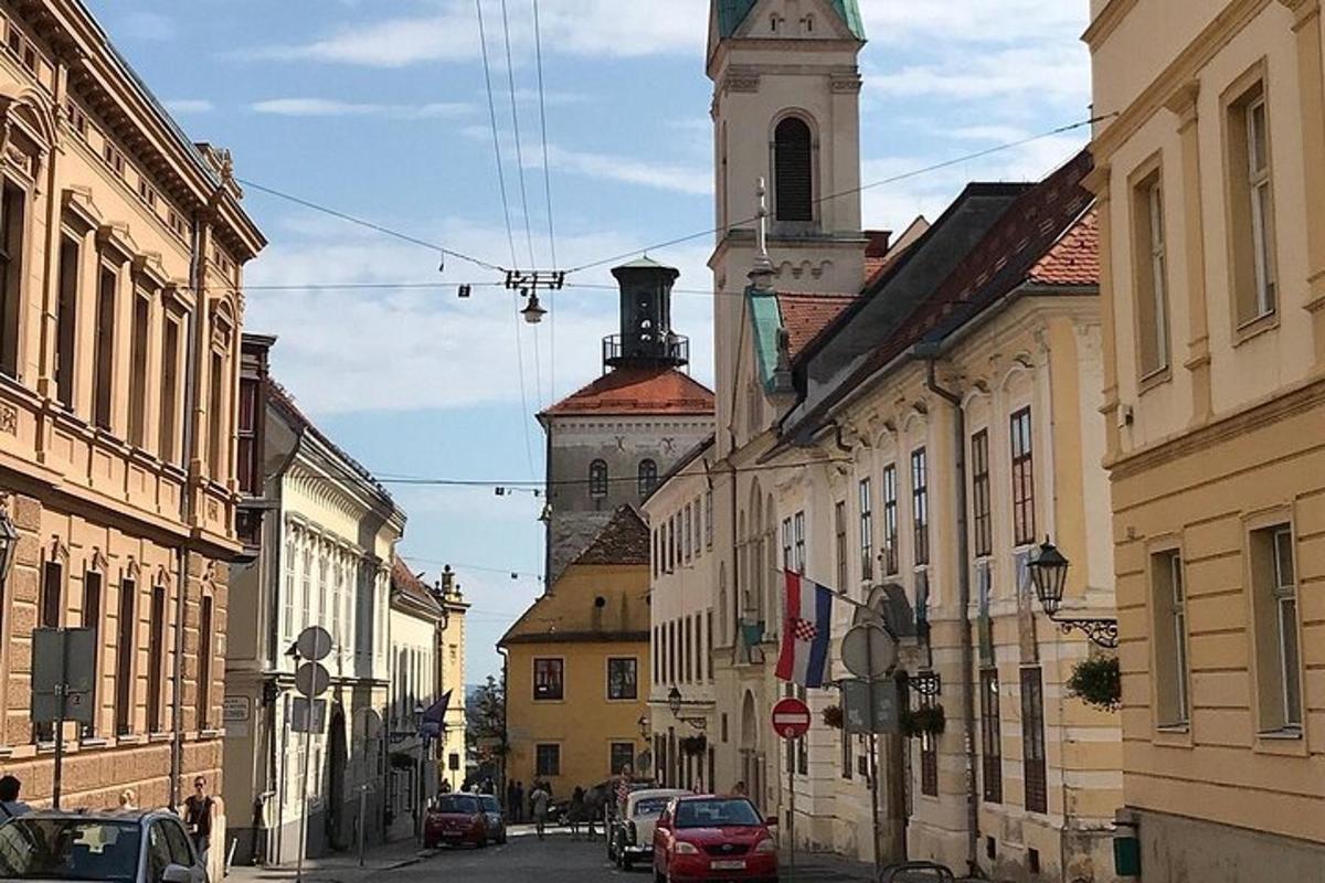 a city street with buildings and a clock tower