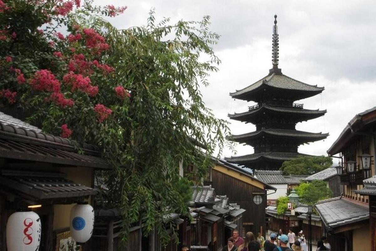 a pagoda in the middle of a street with people