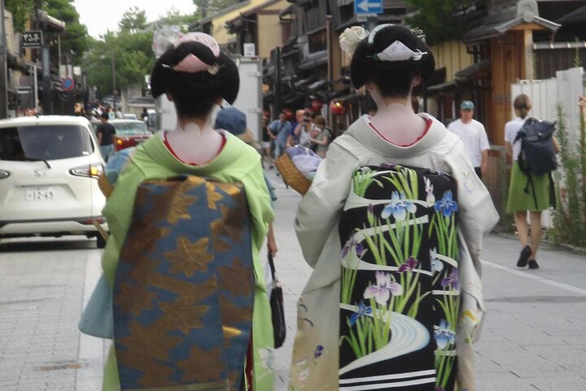 two women walking down a city street wearing