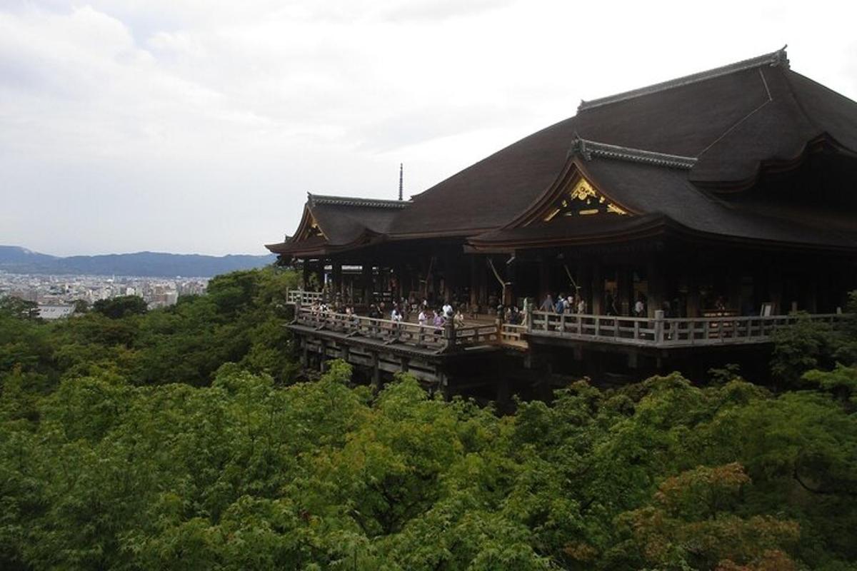 a building on a hill with people standing in it