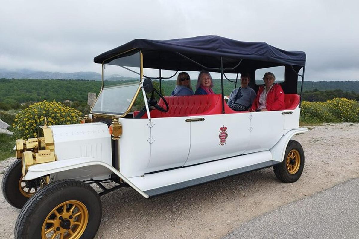 a group of people riding in a golf cart