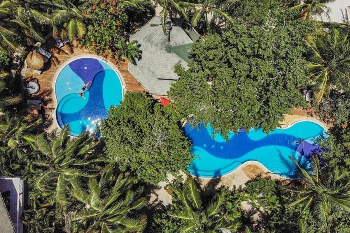 an aerial view of a resort with a swimming pool