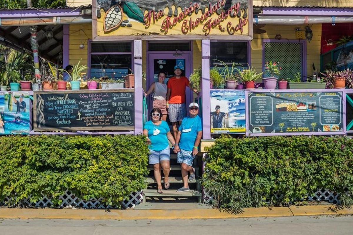 a group of people standing in the doorway of a restaurant