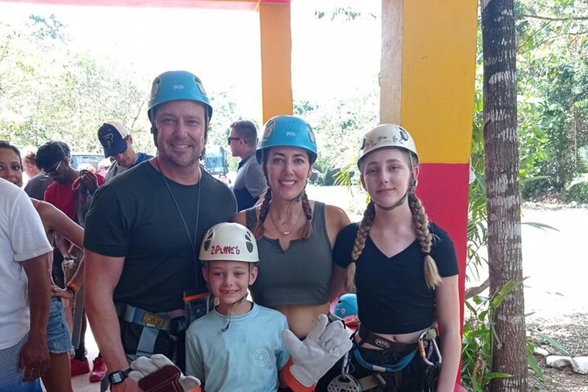 a family wearing hard hats posing for a picture