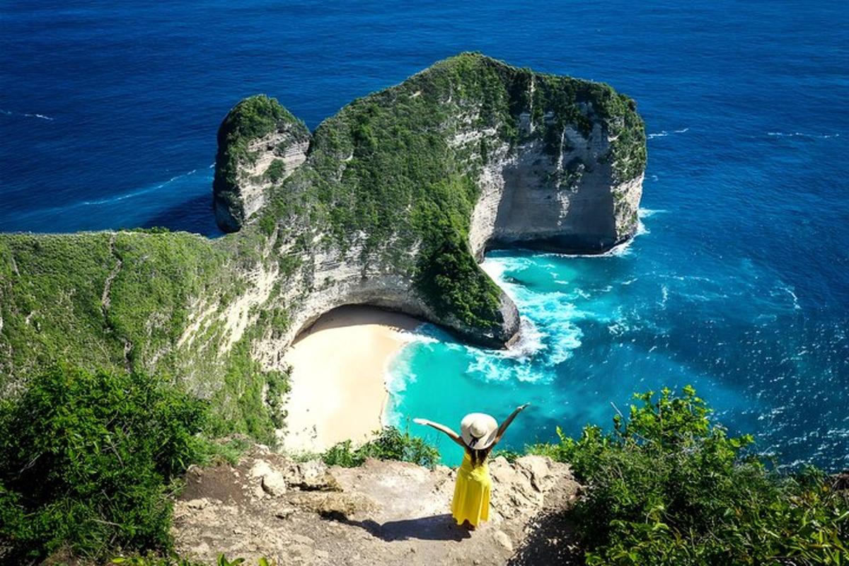 a statue of a rock formation next to a beach