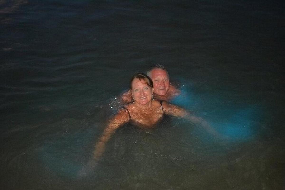 a man and a woman swimming in the ocean