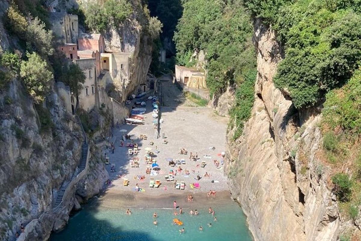 a bunch of people on a beach in the water