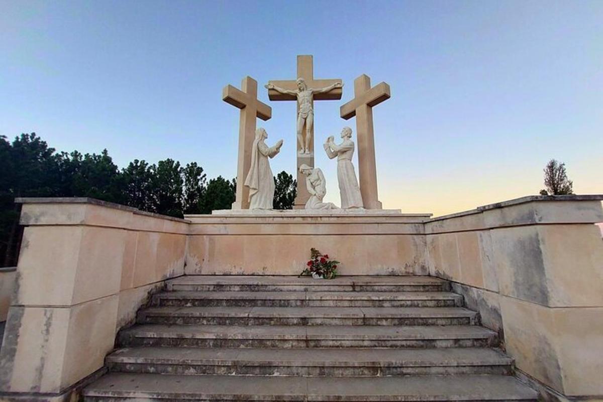 a monument with two crosses on top of a staircase