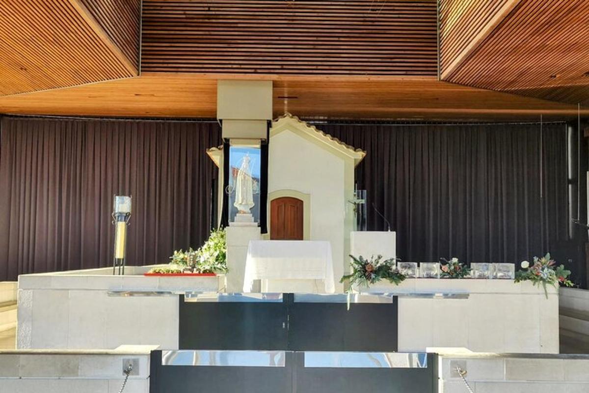 a view of a church with a cross on the altar