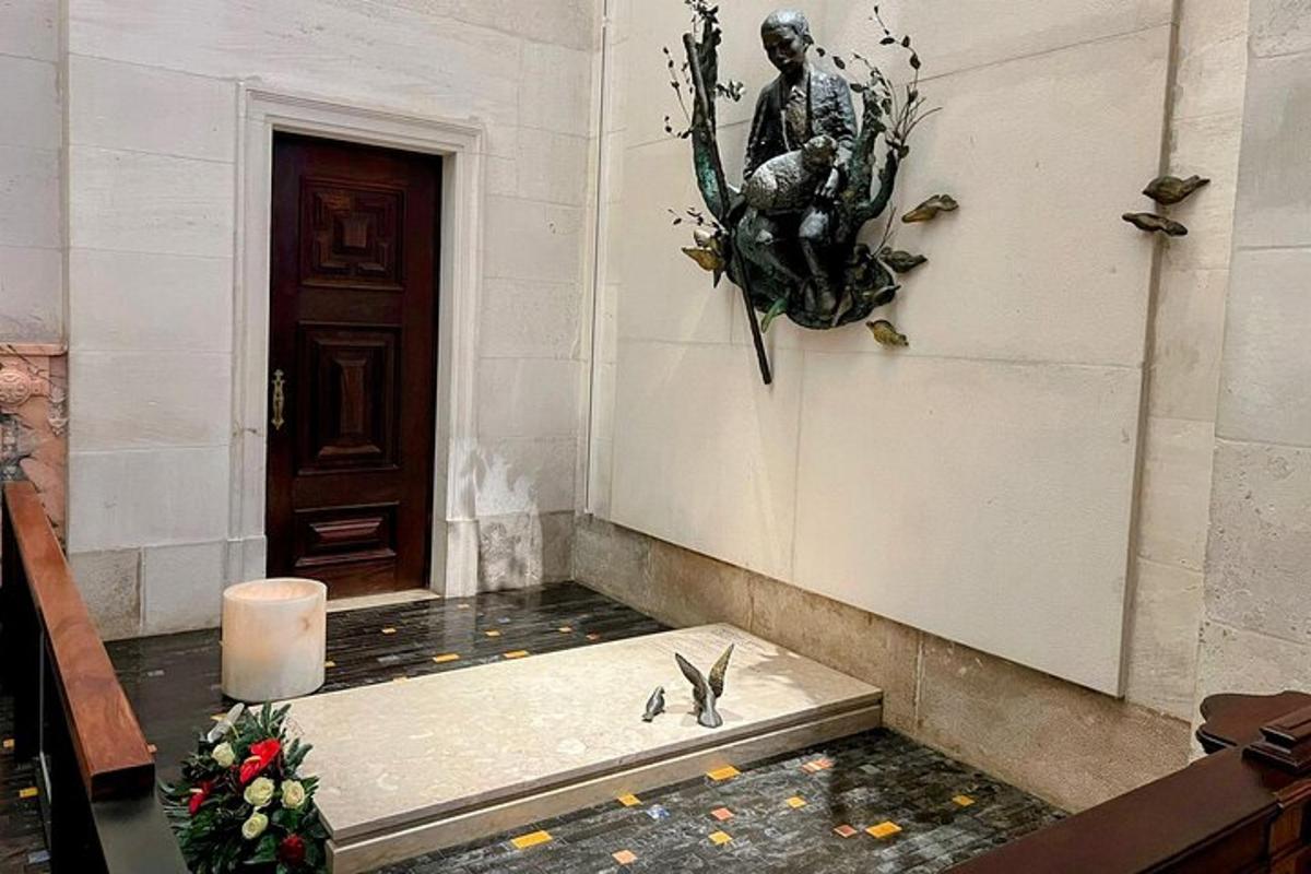 a room with a door and a statue on the wall