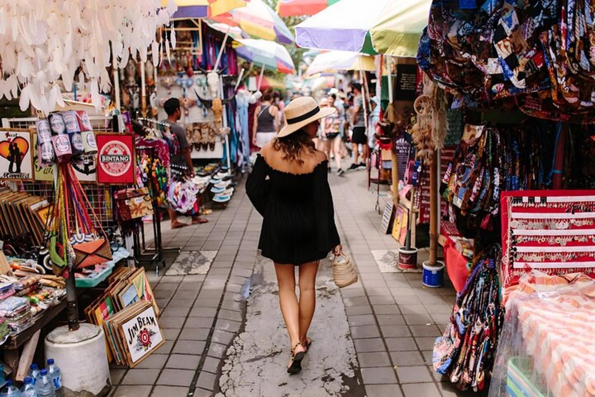 a woman in a hat walking through a market