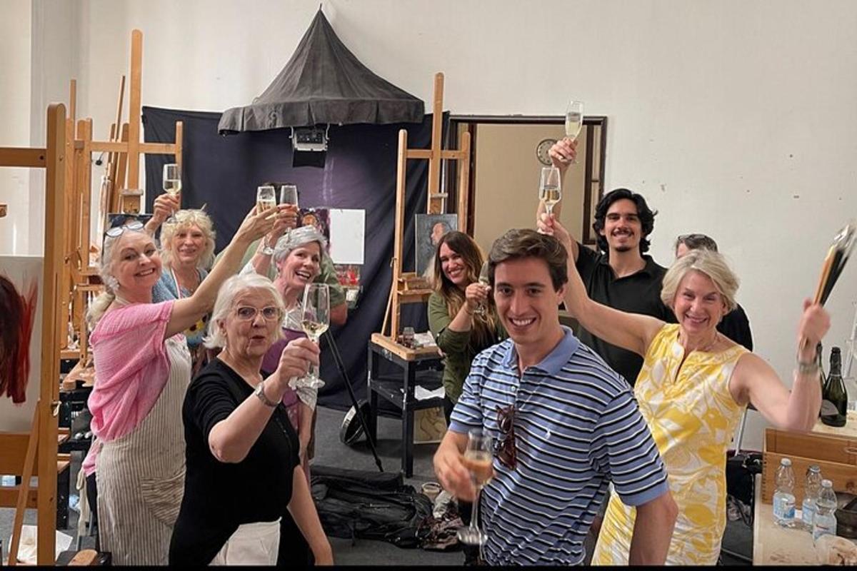 a group of people holding up glasses of wine