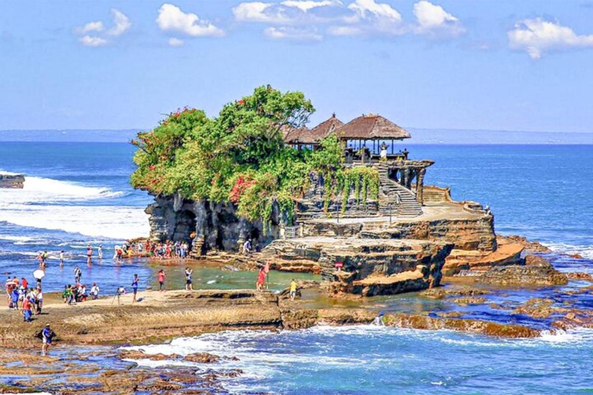 a group of people on an island in the ocean
