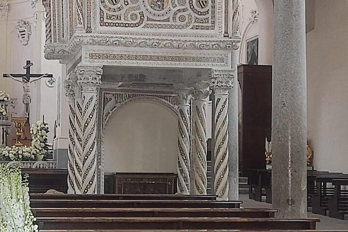 an ornate altar in a church with a cross