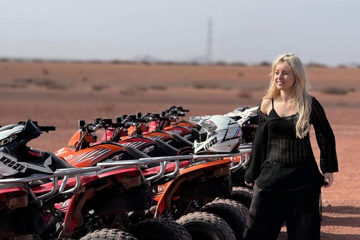 a woman standing next to a row of atvs