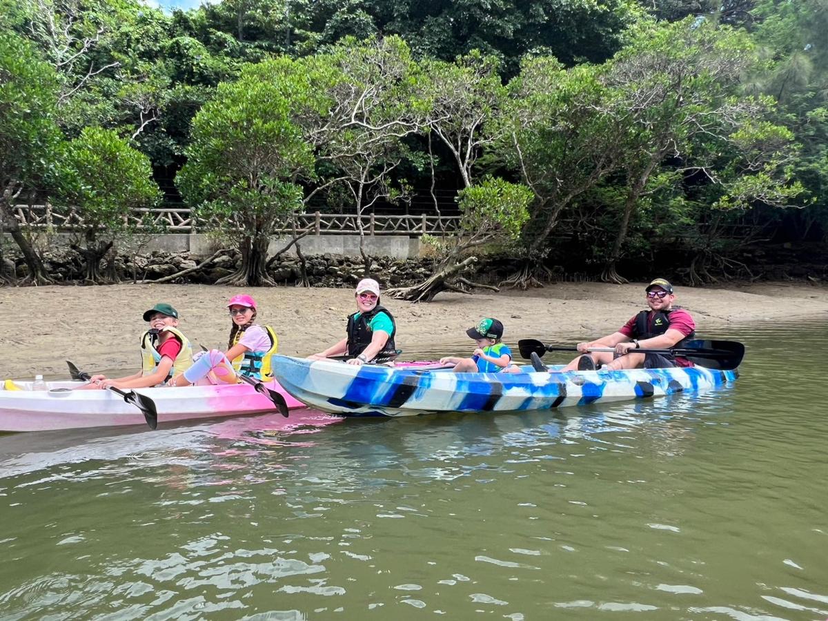 a group of people in a boat on the water