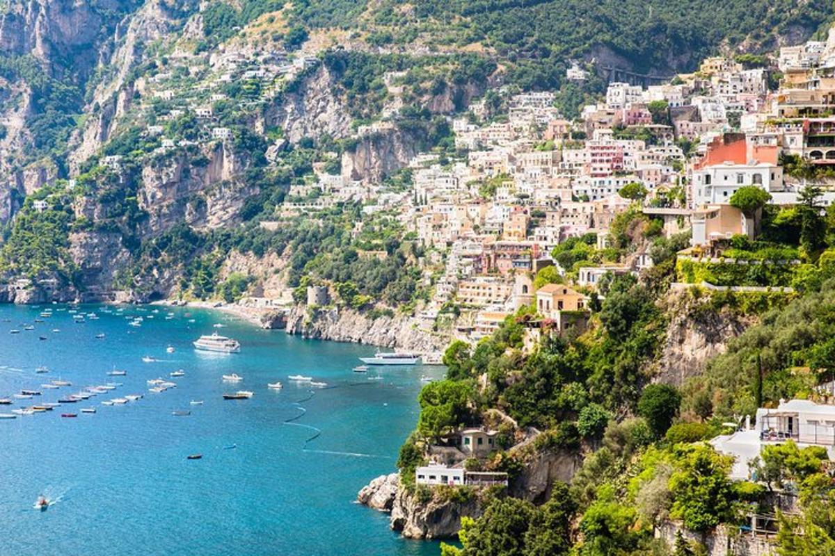 a view of the amalfi coast with boats in the water
