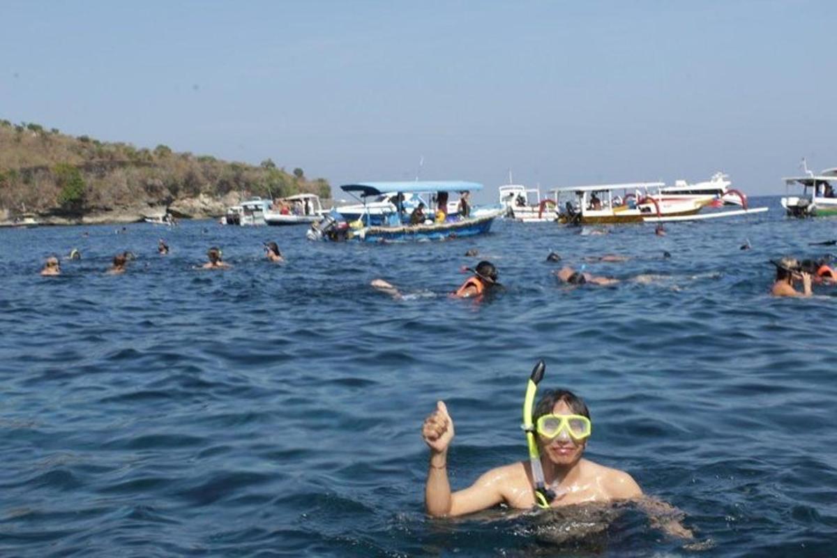 a woman in the water with a pair of skis