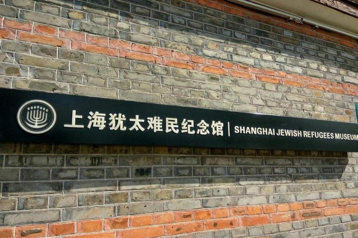 a sign on the side of a brick building