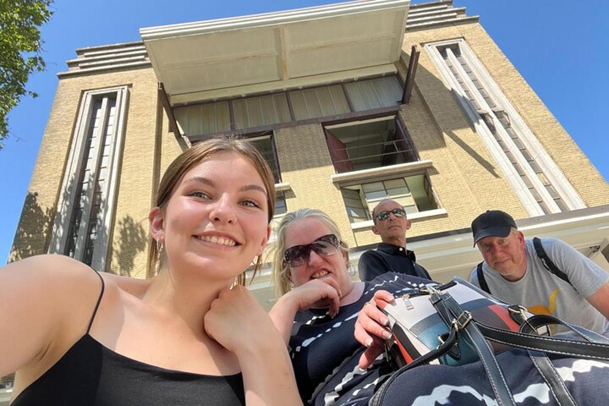 a woman and a man standing in front of a building