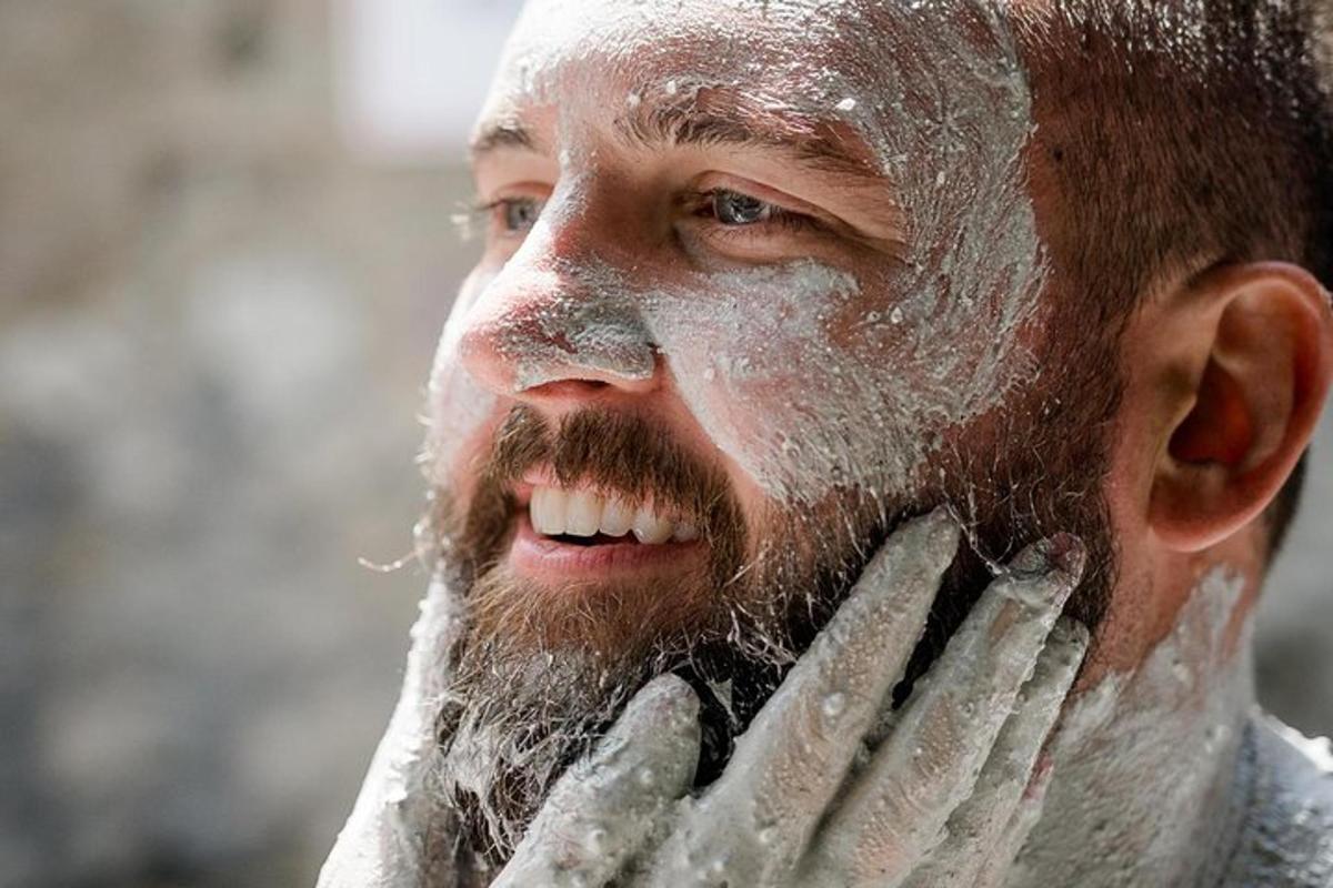 a man with a beard and snow on his face