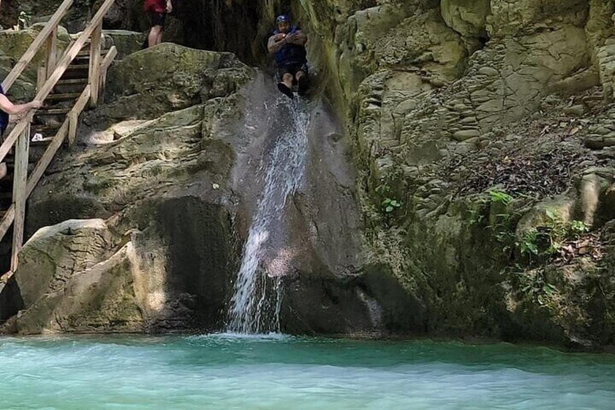 a person standing in front of a waterfall