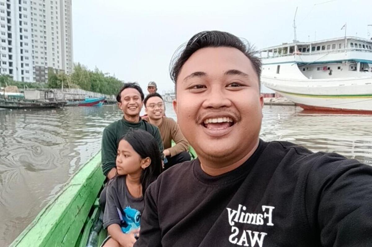 a group of people on a boat in the water