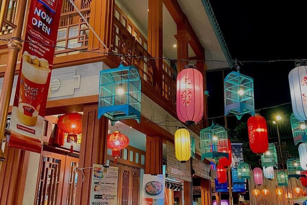 a group of lanterns hanging from the side of a building