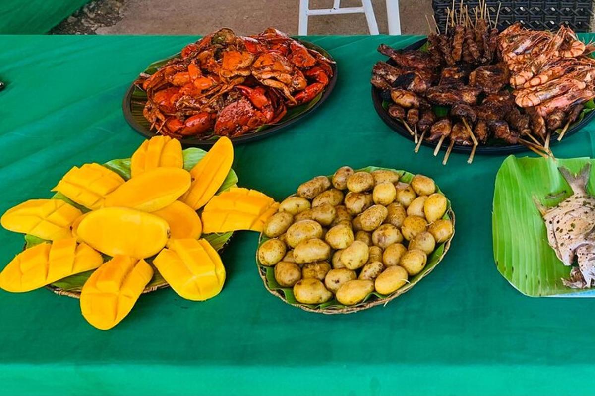a green table with three plates of food on it
